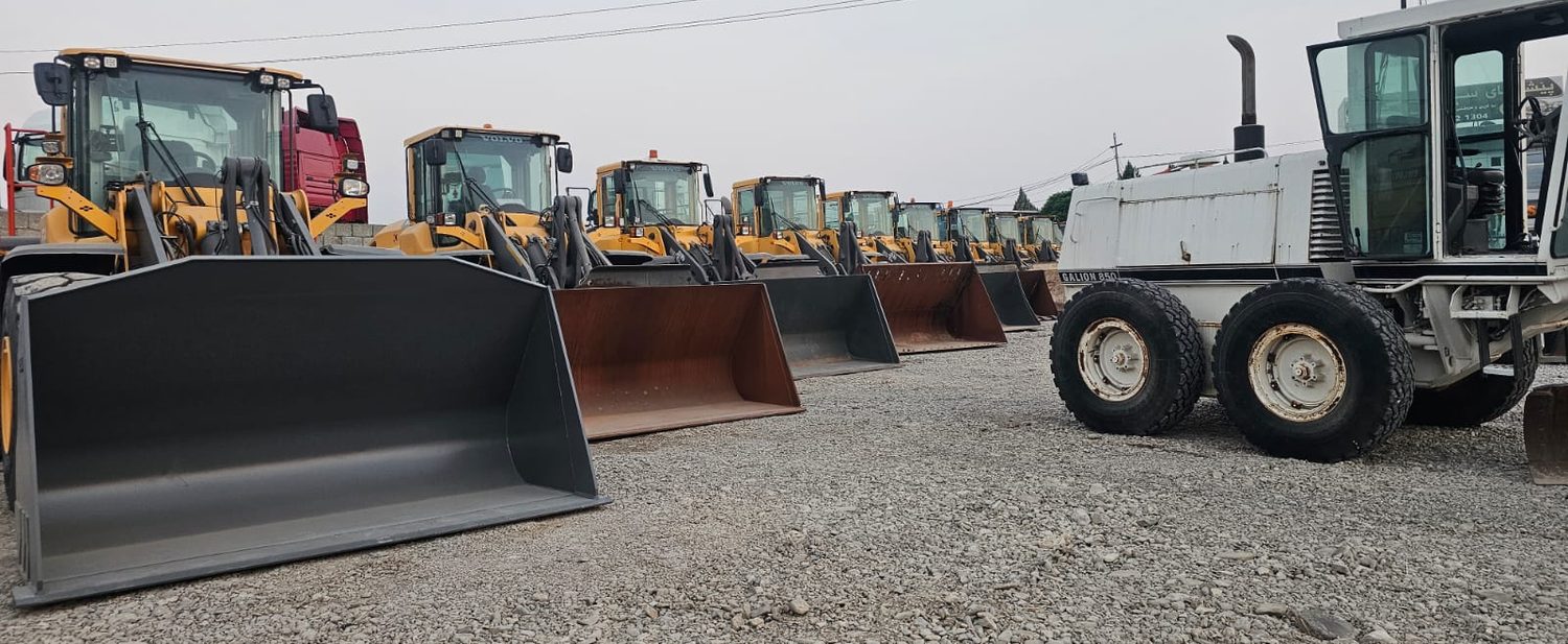 Loaders and grader in the yard